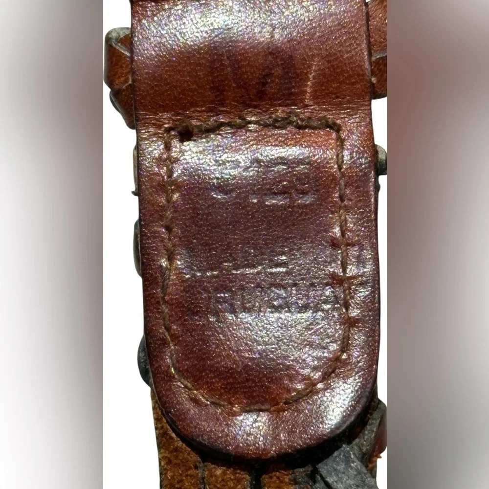 A men’s / women’s leather braided belt, Made in Uraguay. M.